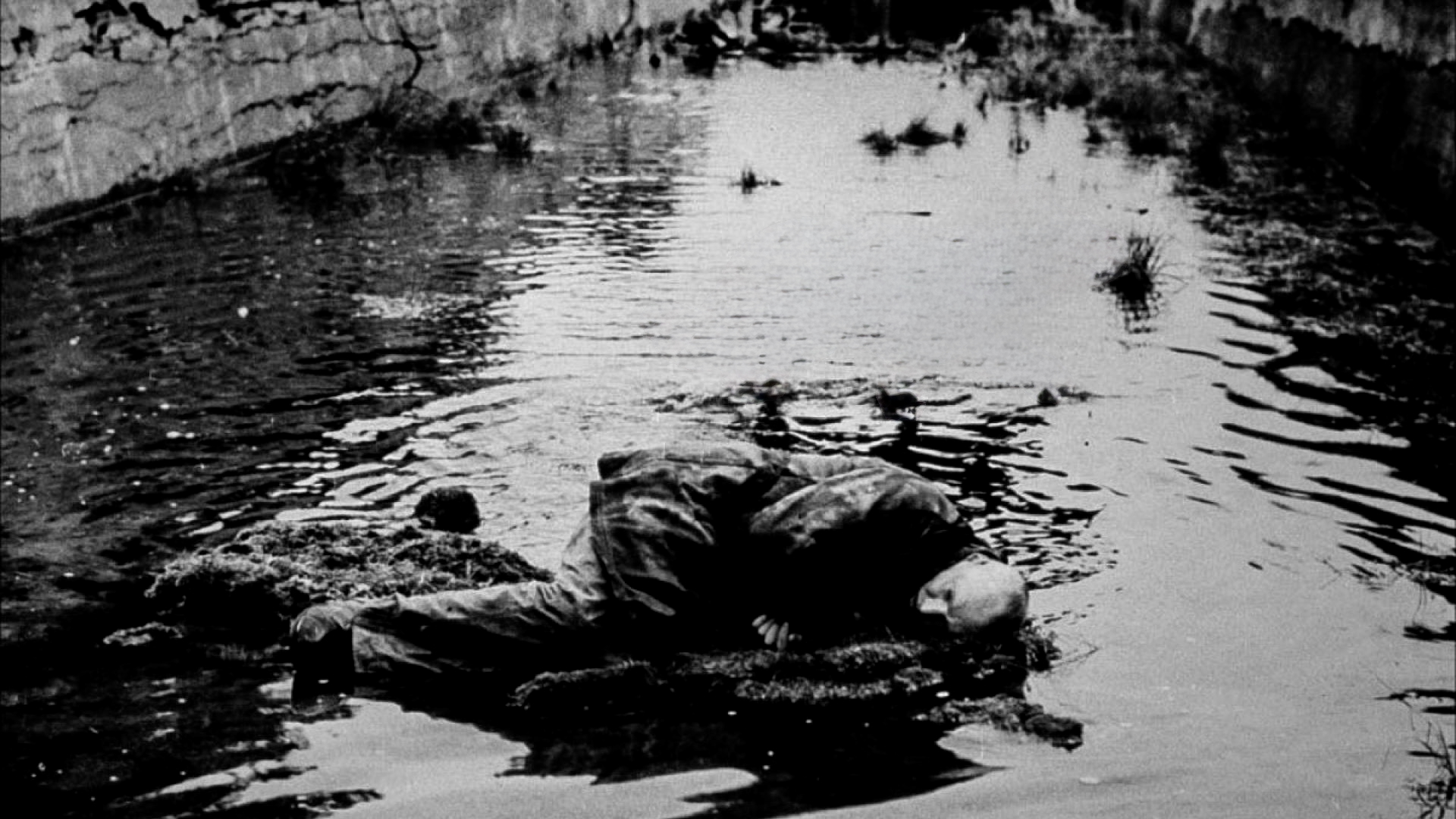 Canyon image -man laying in stream at the bottom of a canyon